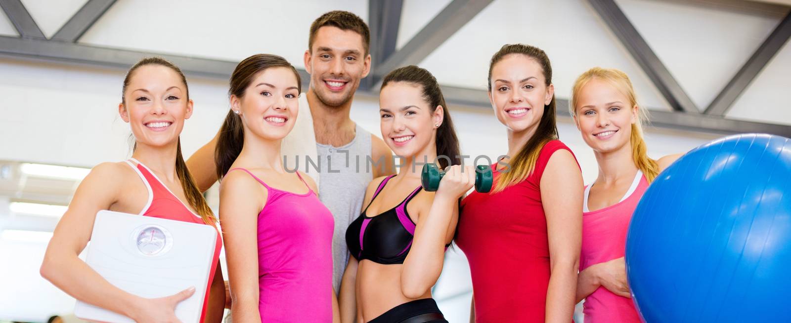 fitness, sport, training, gym and lifestyle concept - group of smiling people in the gym