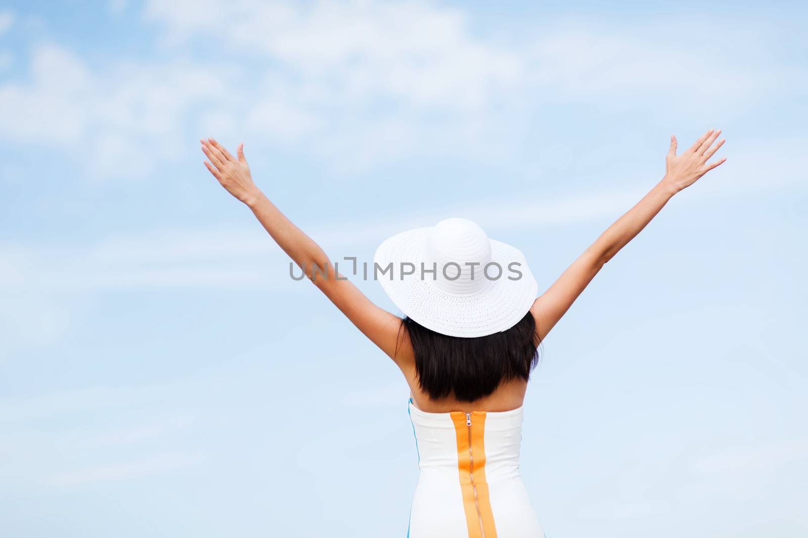 girl with hands up on the beach by dolgachov