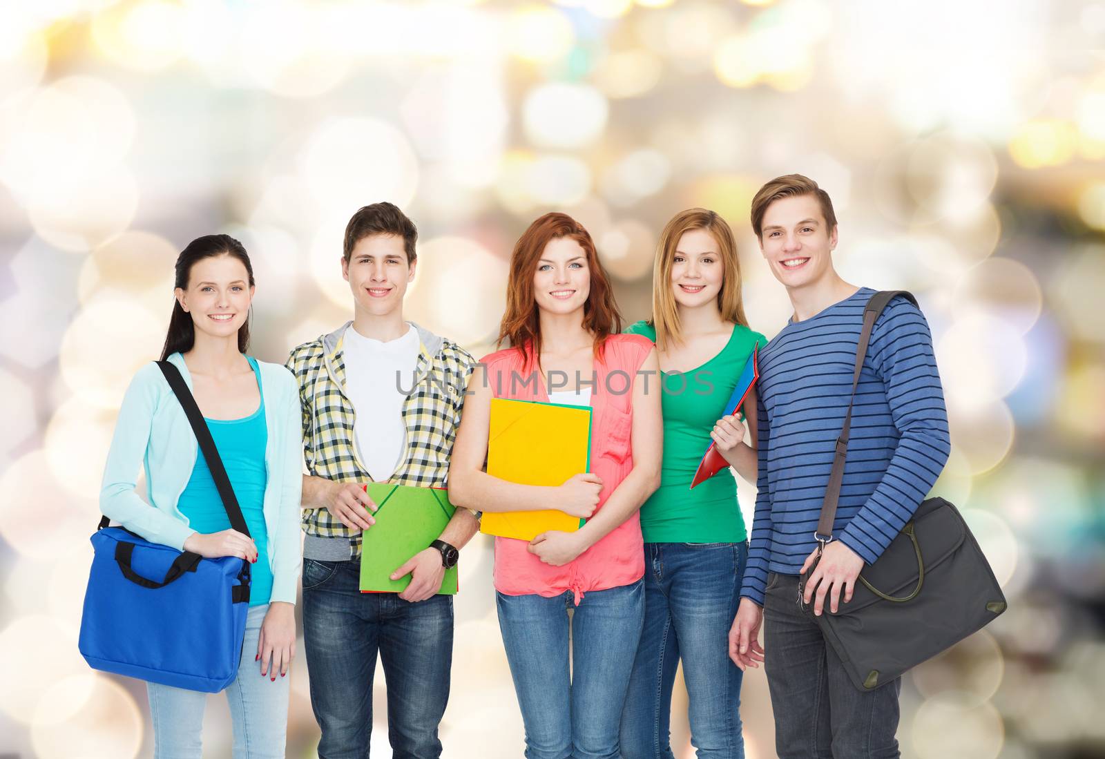 education and people concept - group of smiling students standing