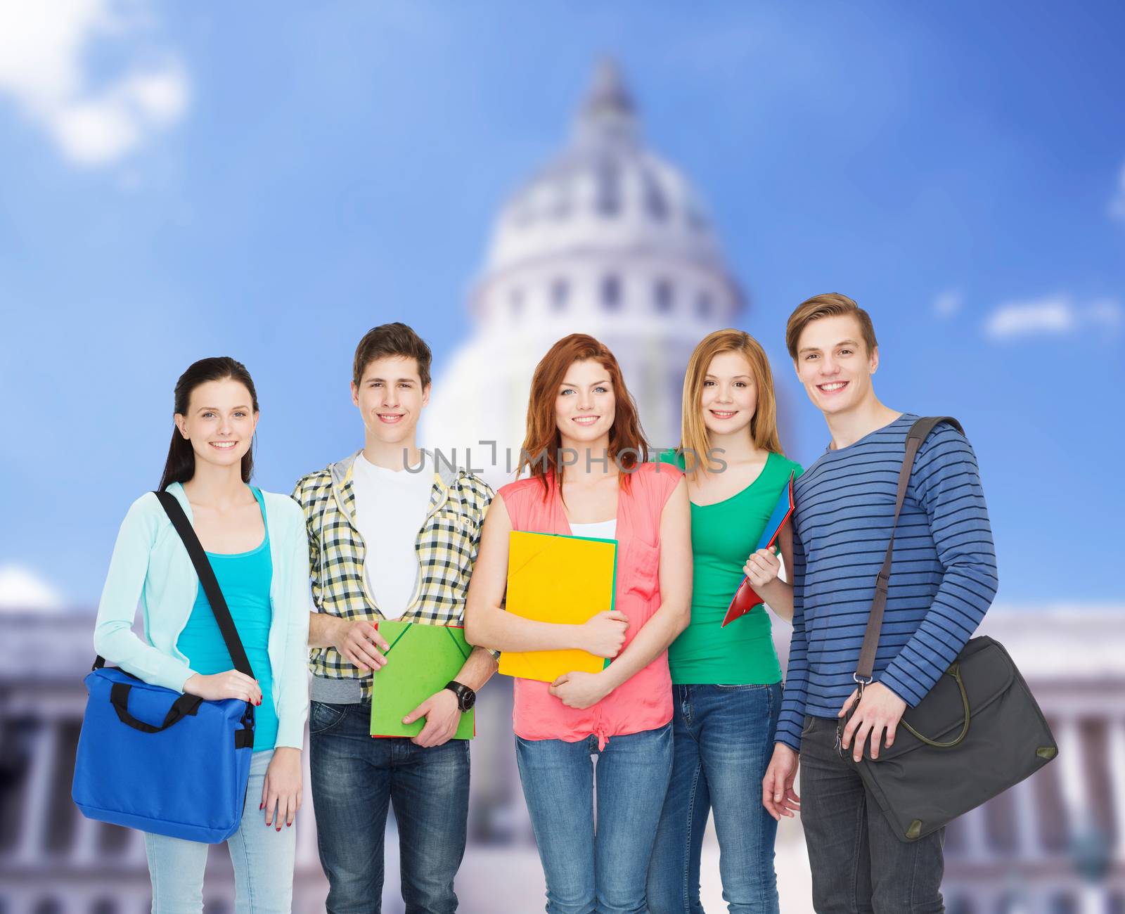 education and people concept - group of smiling students standing