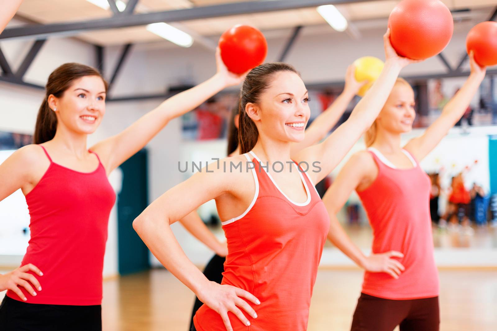 group of people working out with stability balls by dolgachov