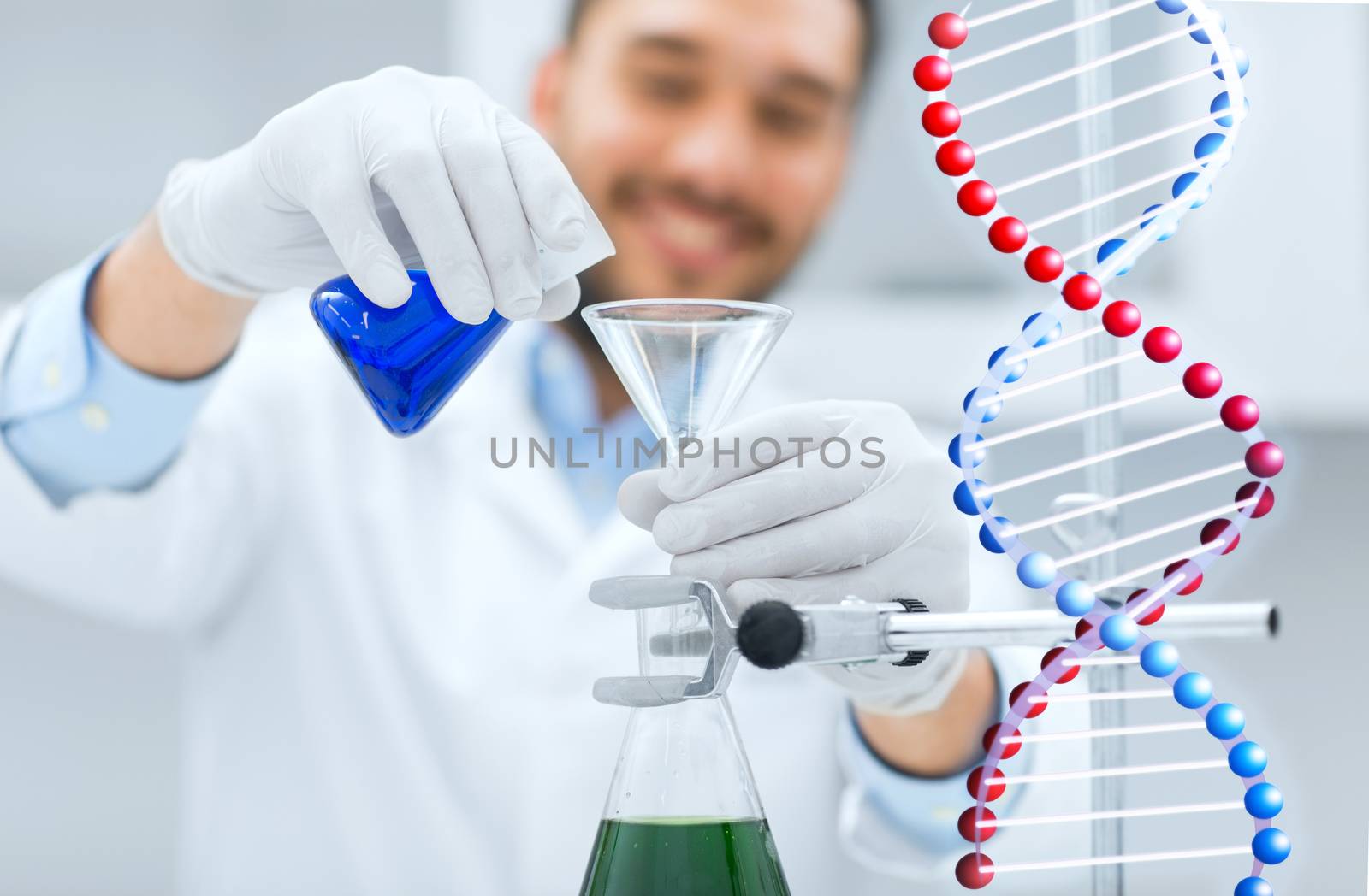 science, chemistry, biology, medicine and people concept - close up of scientist filling test tubes with funnel and making research in clinical laboratory