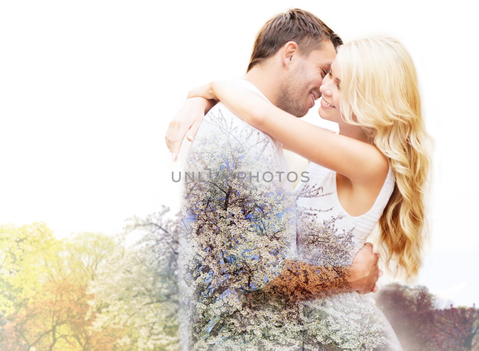 spring, love, romance, double exposure and dating concept - happy couple hugging over cherry blossom background