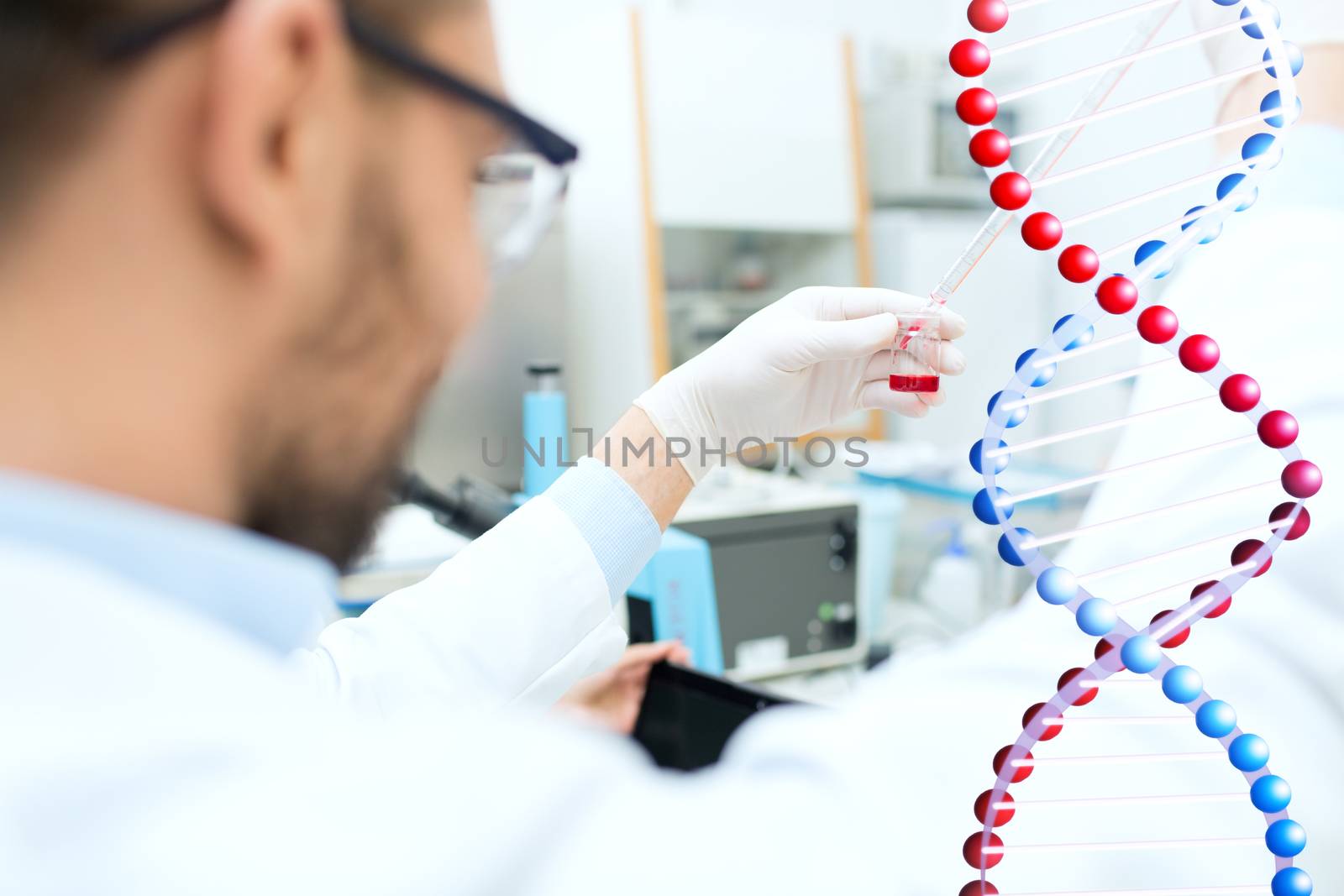 science, chemistry, biology, medicine and people concept - close up of male scientist with test tube and pipette making research in clinical laboratory