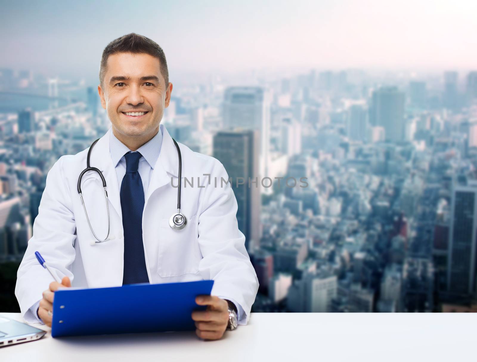 happy doctor with clipboard over city background by dolgachov