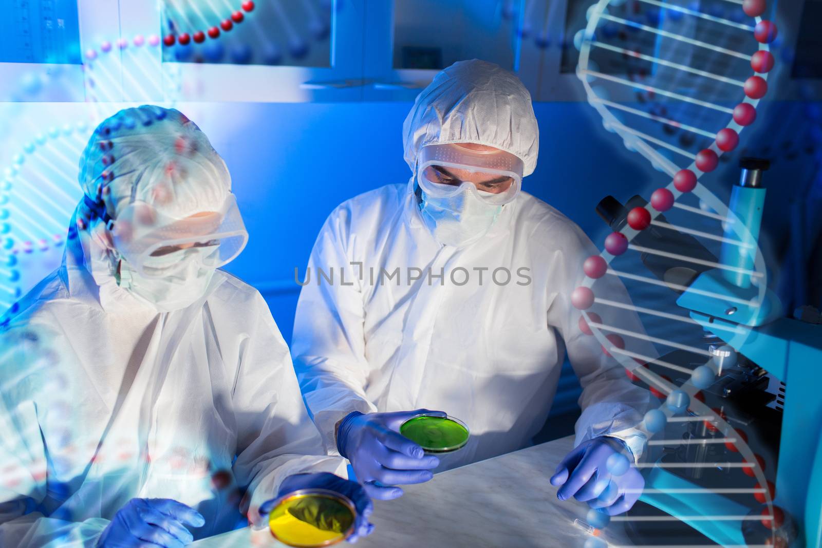 science, chemistry and people concept - close up of scientists with chemical samples in petri dish making test or research at laboratory over dna molecule structure