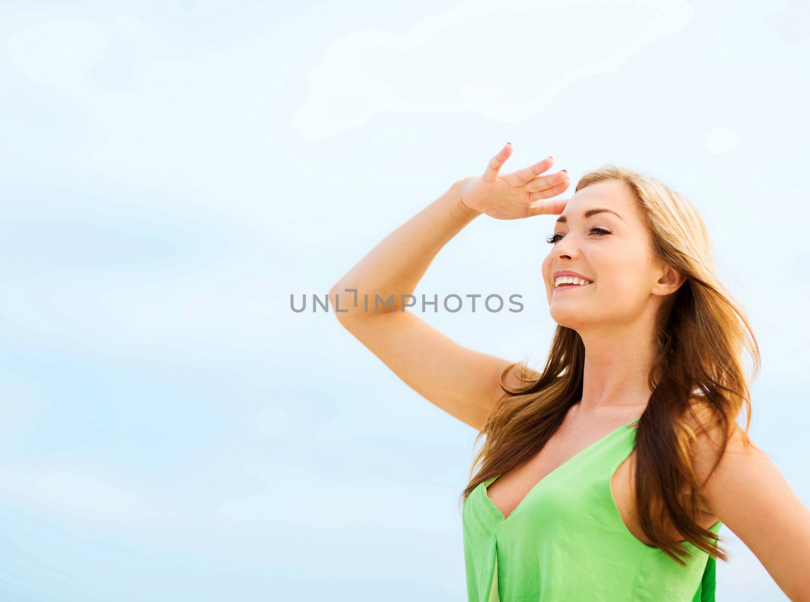 summer holidays and vacation - girl looking for direction on the beach