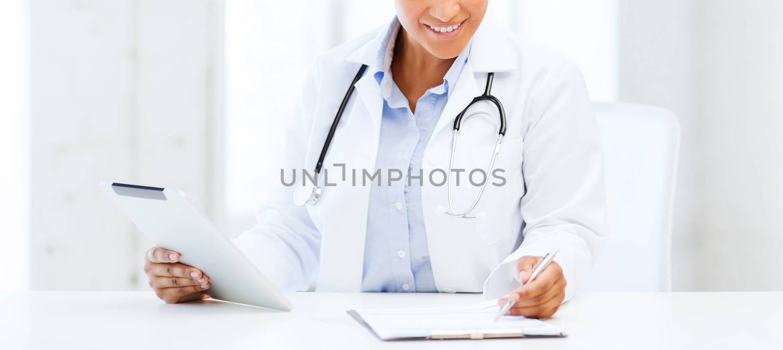 female doctor with tablet pc by dolgachov