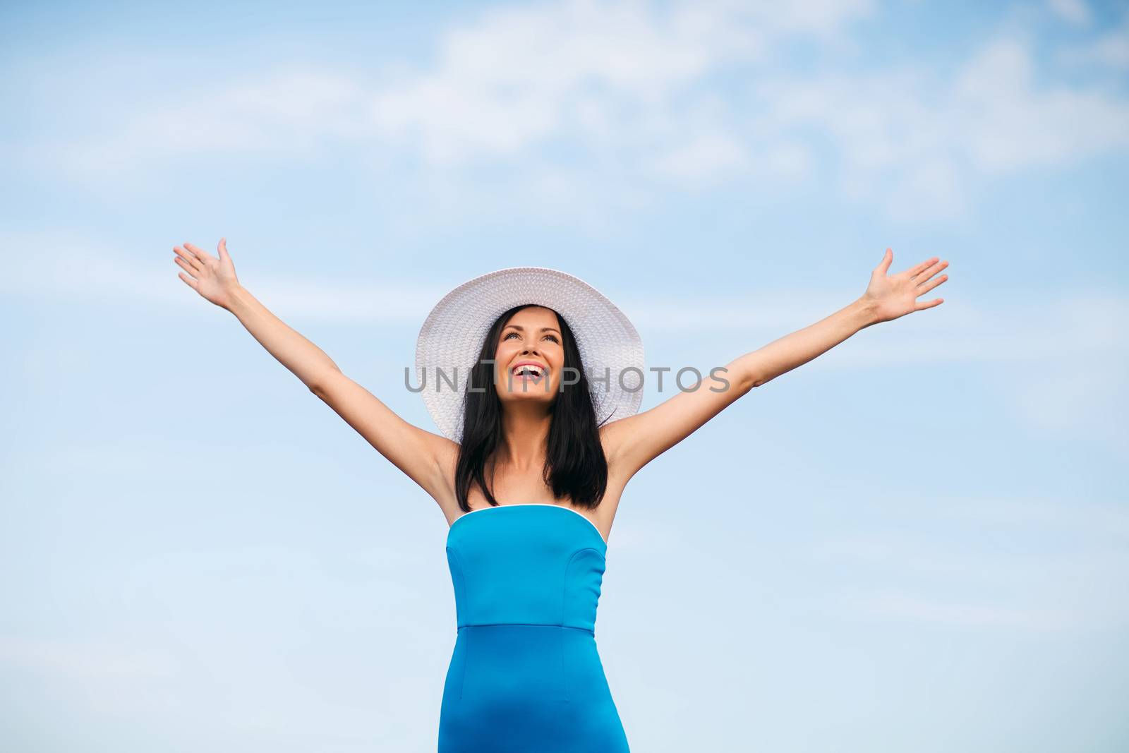 girl with hands up on the beach by dolgachov