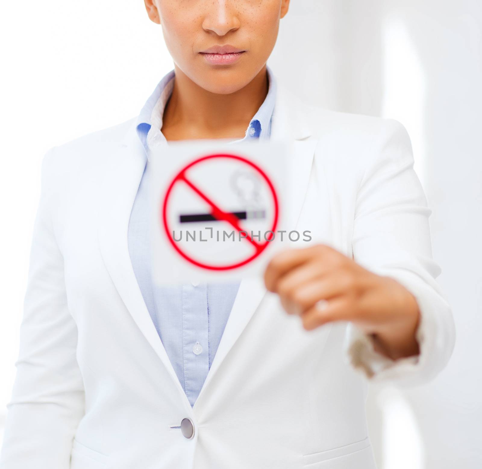 health and healthcare concept - picture of african woman with restriction no smoking sign