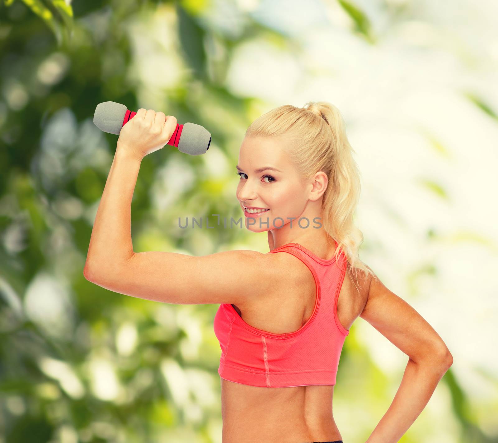 fitness, sport and diet concept - young sporty woman with light dumbbell