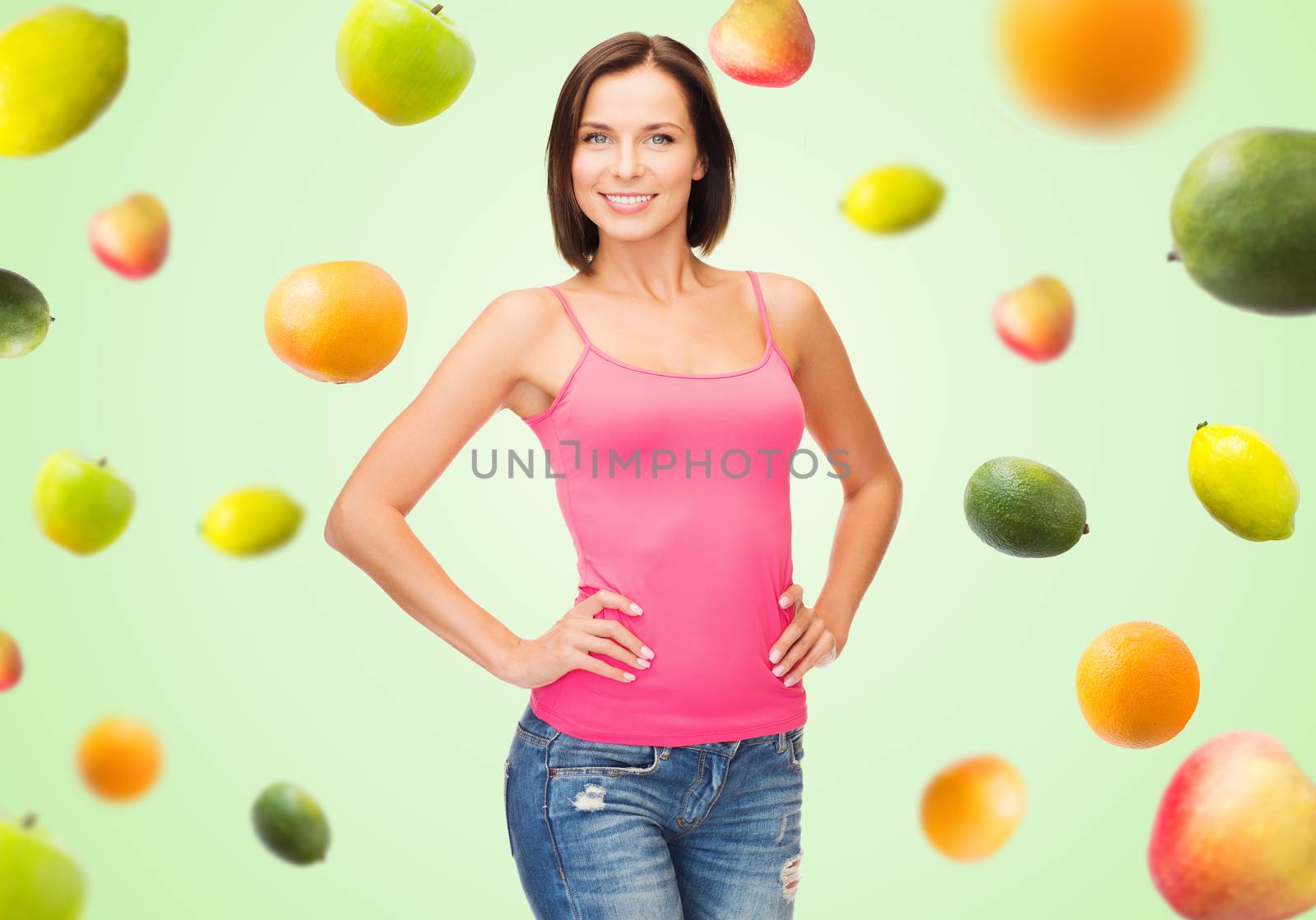 woman in blank pink tank top over fruits on green by dolgachov
