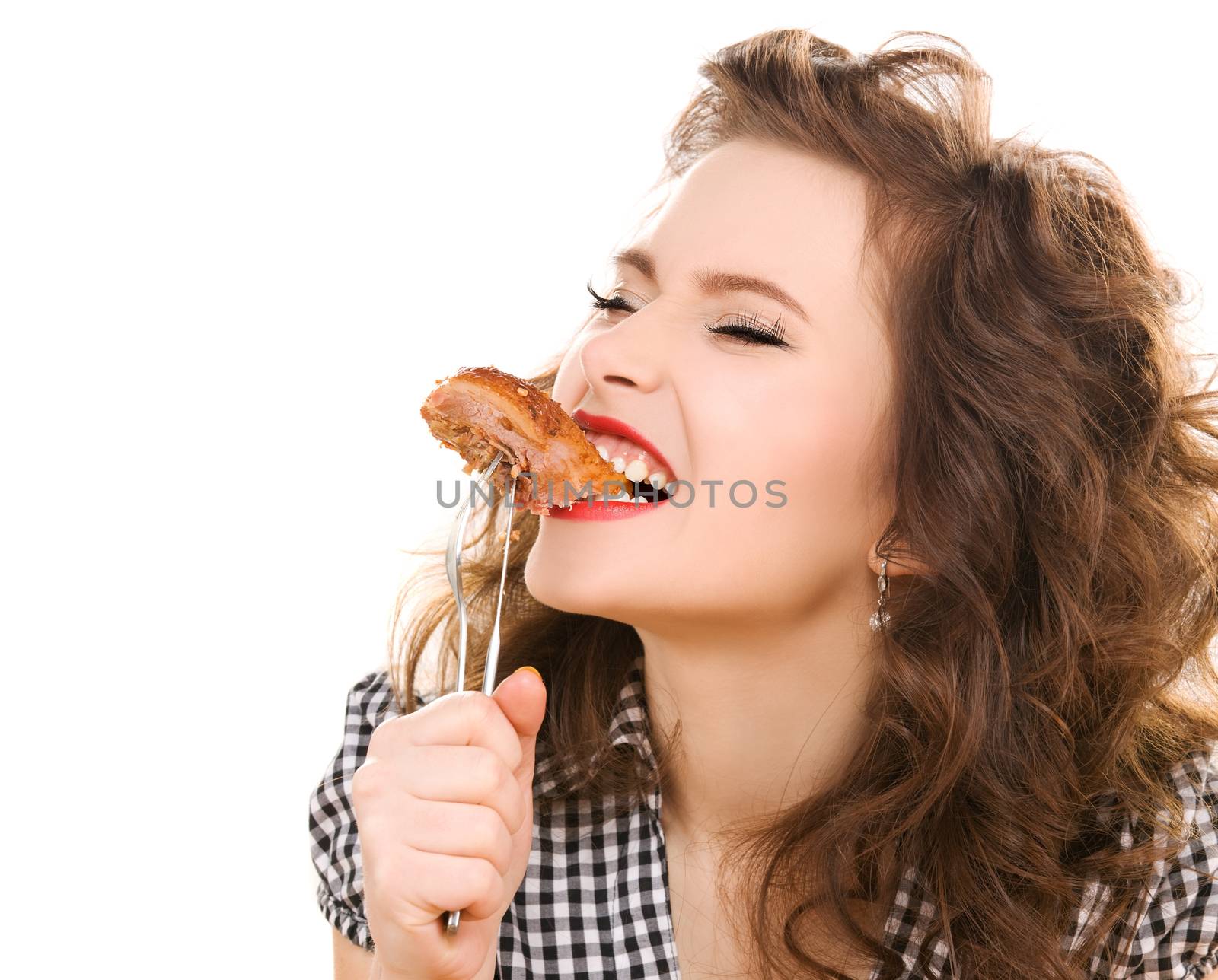 paleo diet concept - woman eating meat by dolgachov