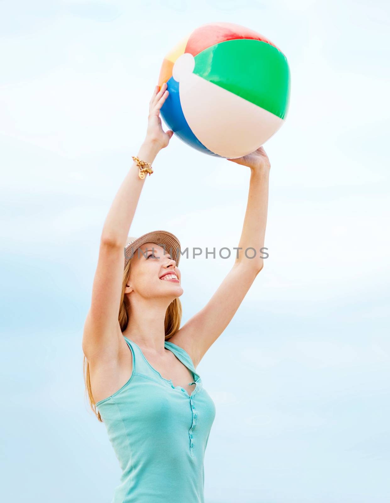 girl playing ball on the beach by dolgachov