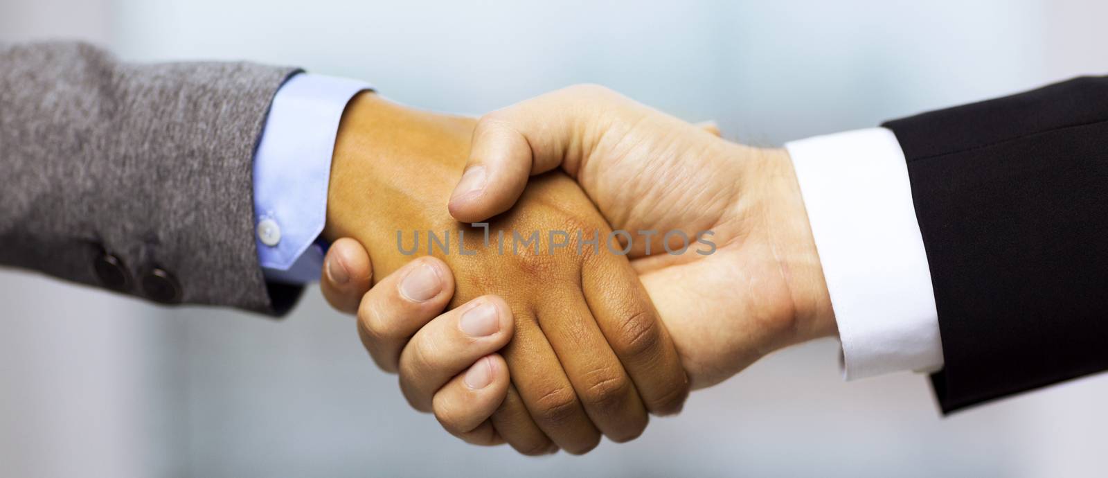 business and office concept - businessman and businesswoman showing shaking hands in office