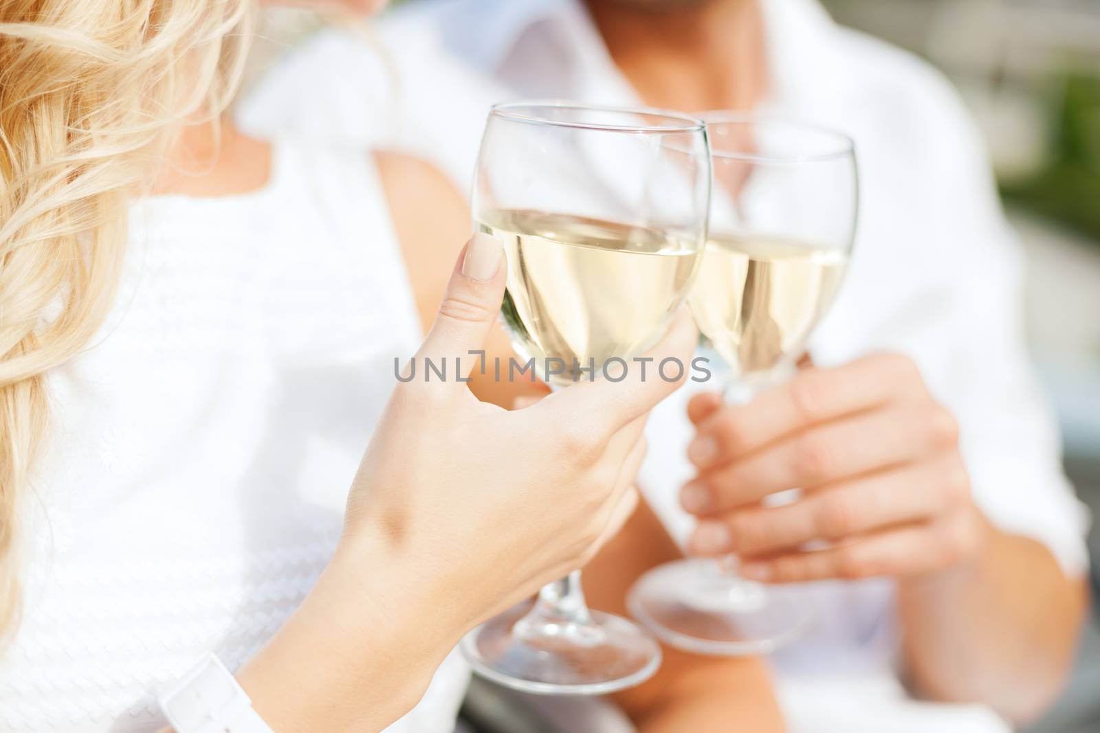 couple drinking wine in cafe by dolgachov