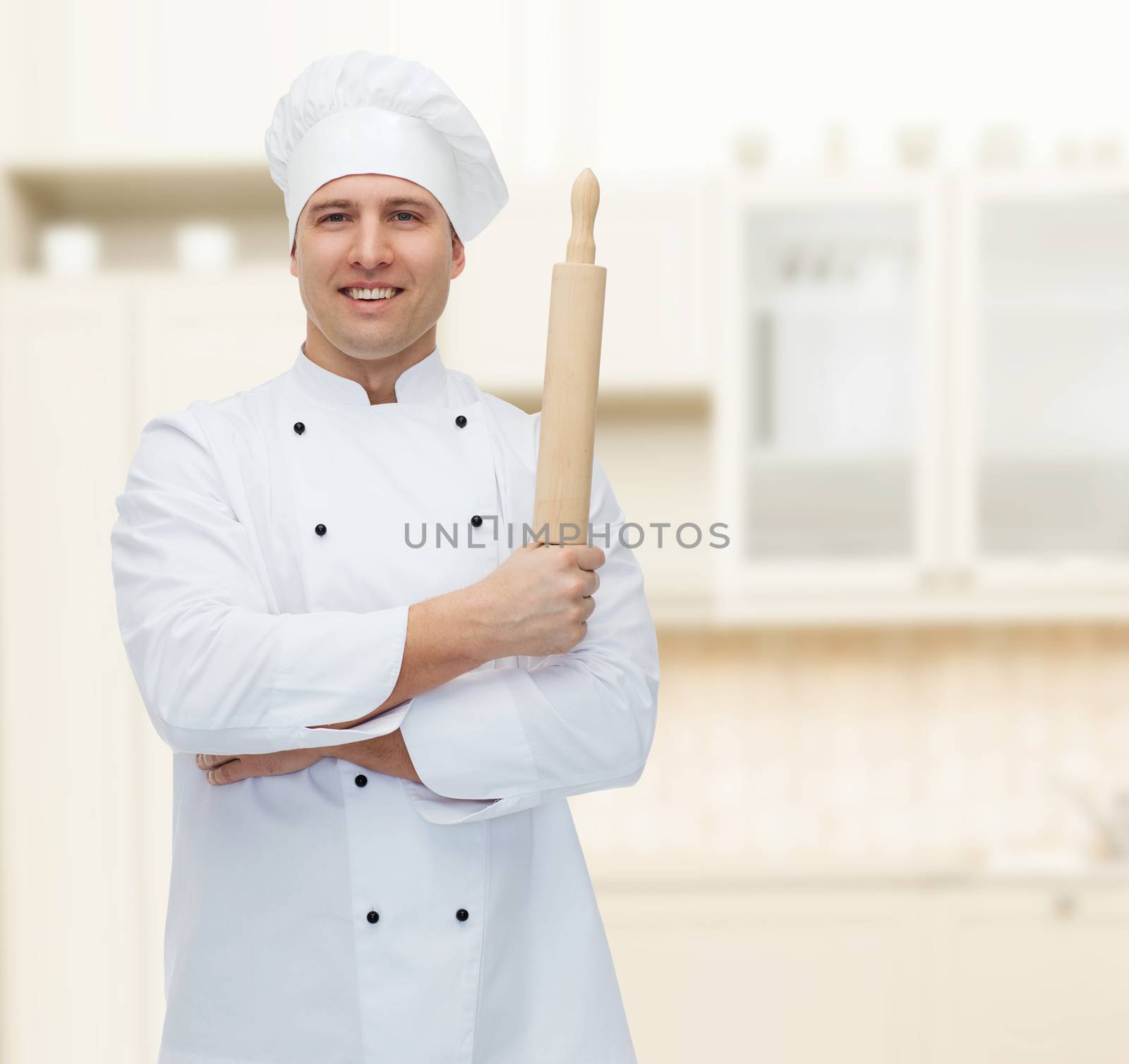 cooking, profession and people concept - happy male chef cook holding rolling pin