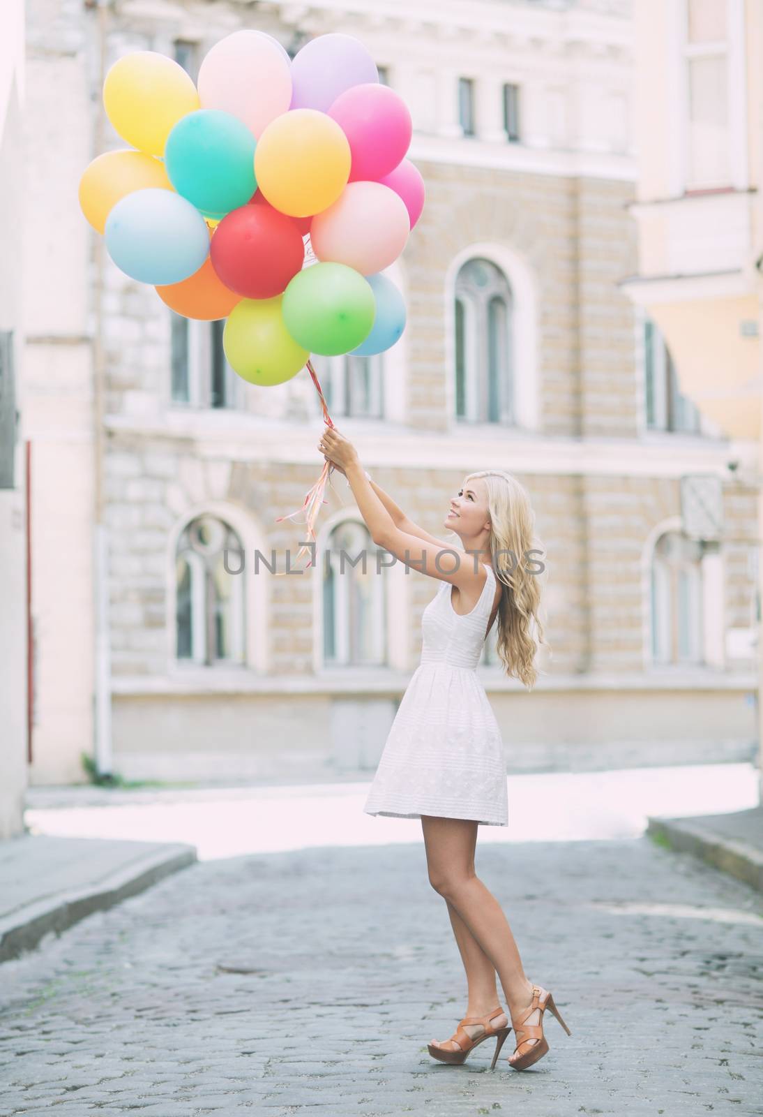 woman with colorful balloons by dolgachov