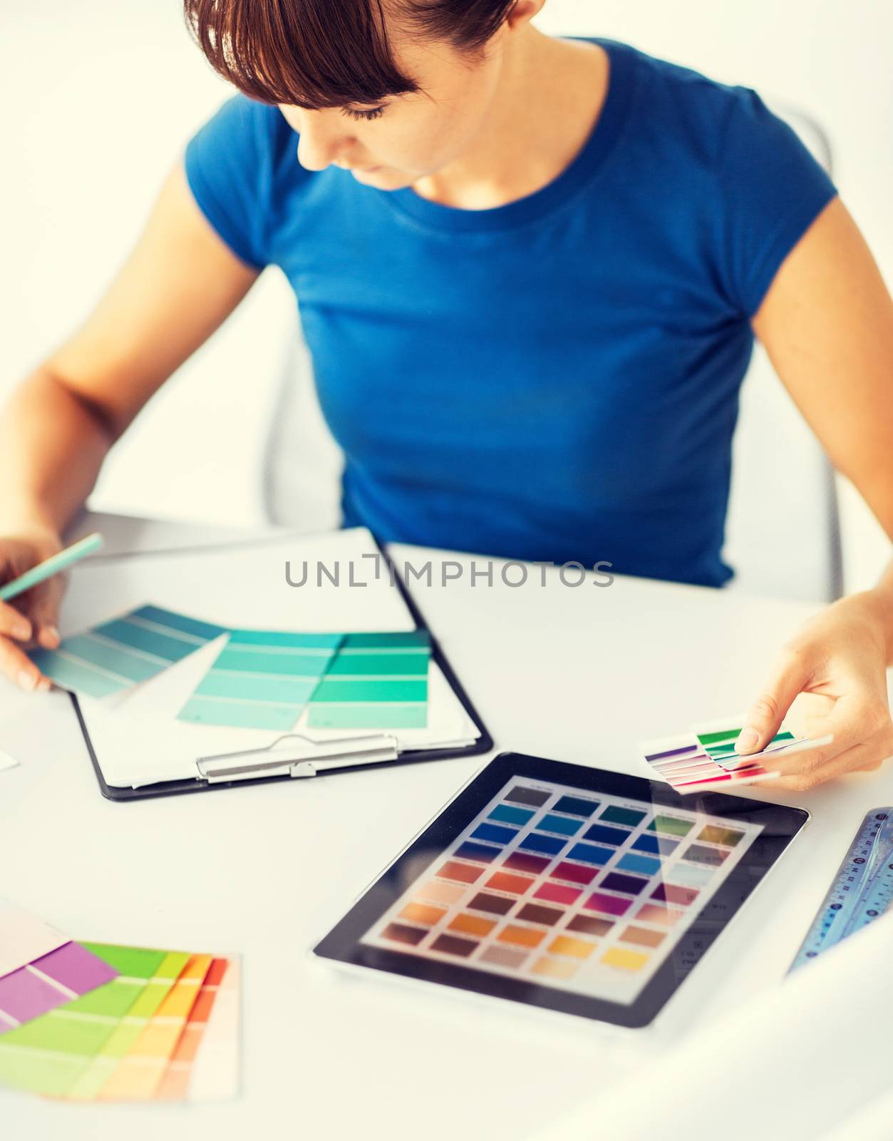 interior design, renovation and technology concept - woman working with color samples for selection