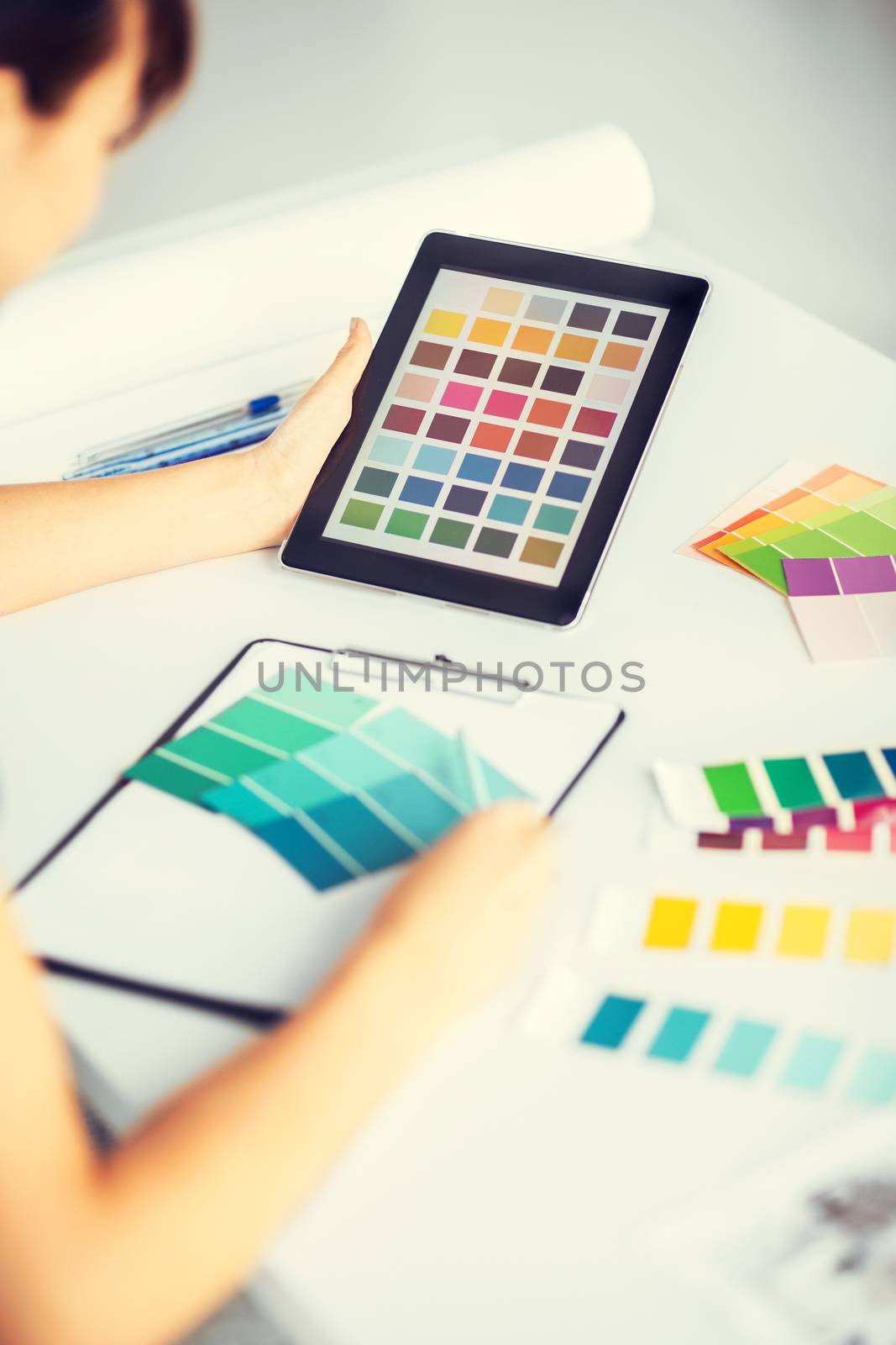 woman working with color samples for selection by dolgachov