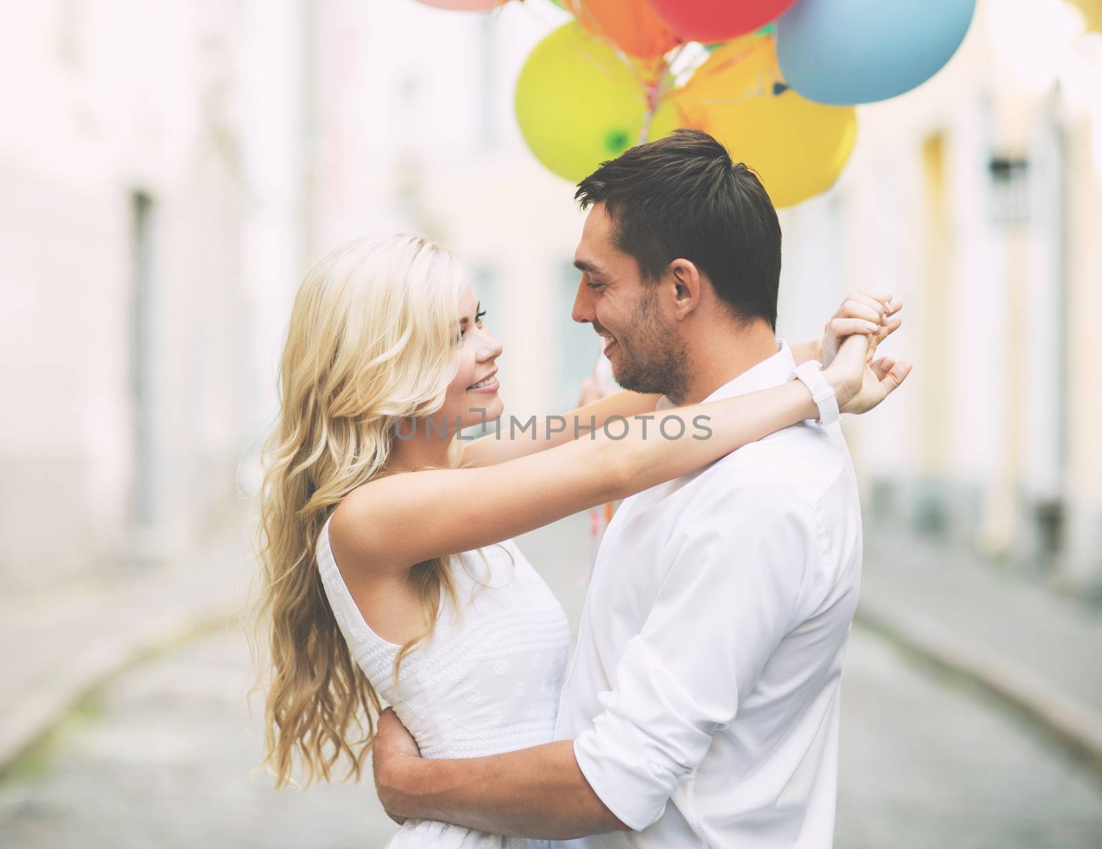 couple with colorful balloons by dolgachov