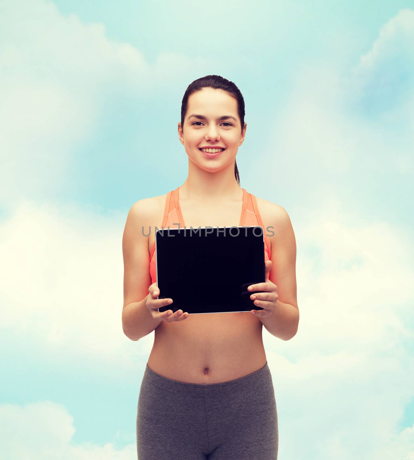 sporty woman with tablet pc blank screen by dolgachov