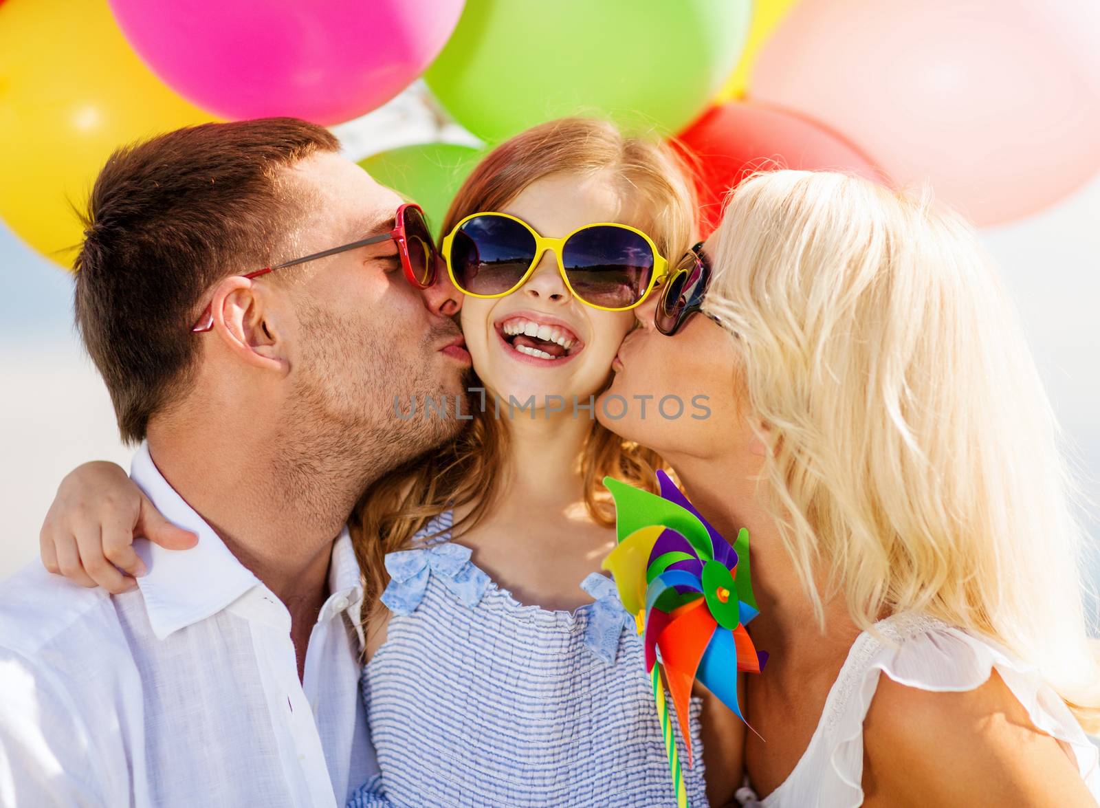 summer holidays, celebration, children and people concept - family with colorful balloons