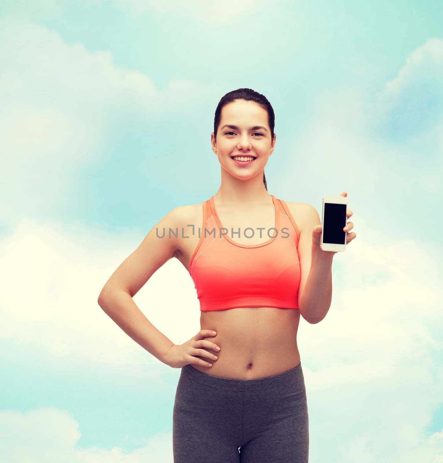 sporty woman with smartphone by dolgachov