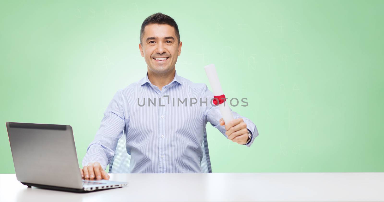 education, graduation, business, technology and people concept - smiling man with diploma and laptop computer sitting at table over green background