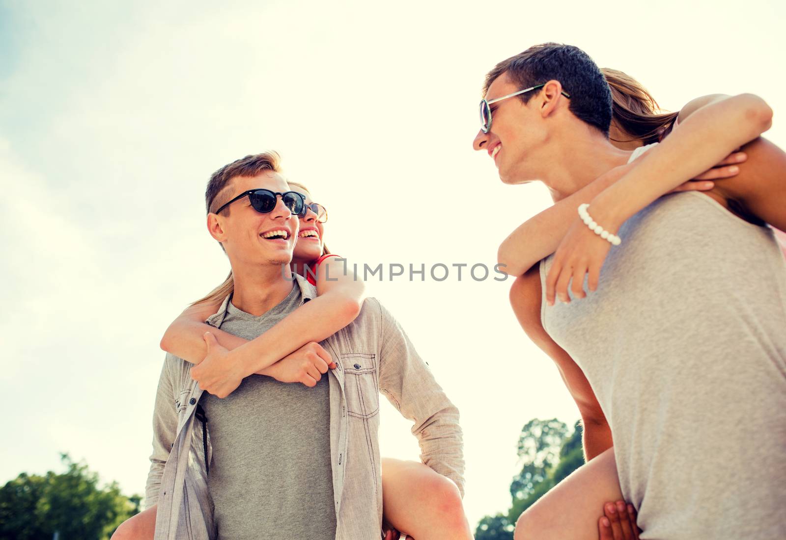 smiling couple having fun in city by dolgachov
