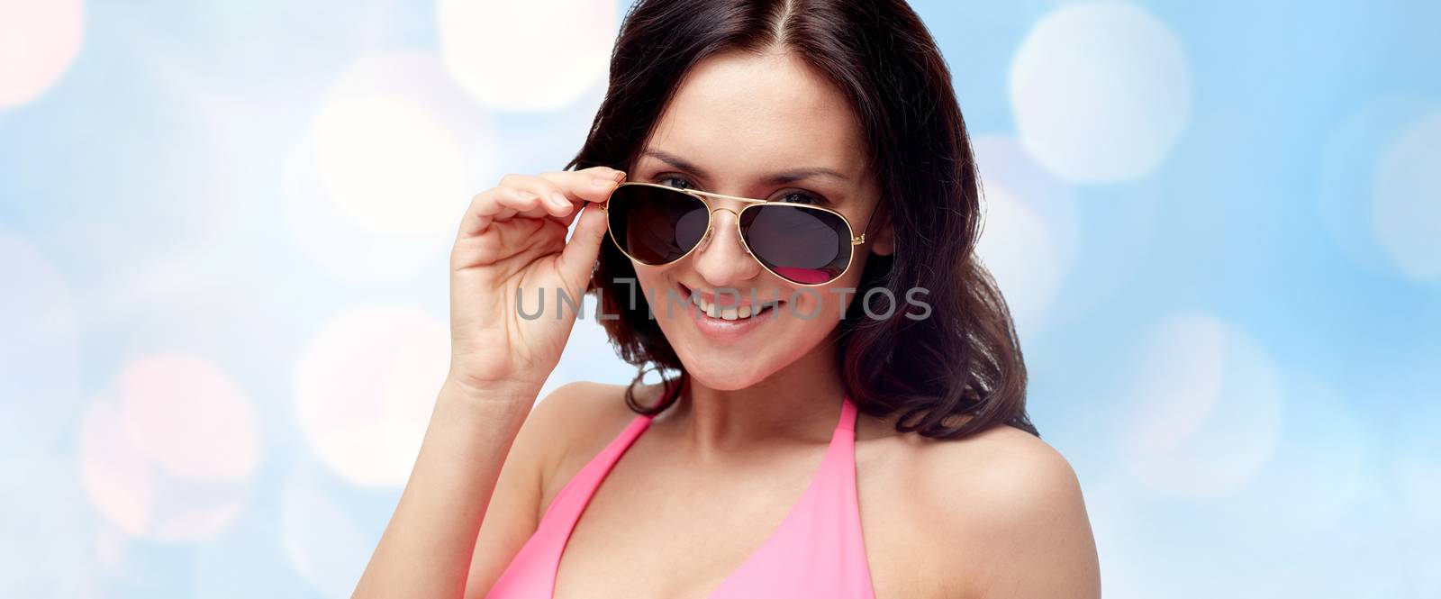 happy woman in sunglasses and swimsuit by dolgachov