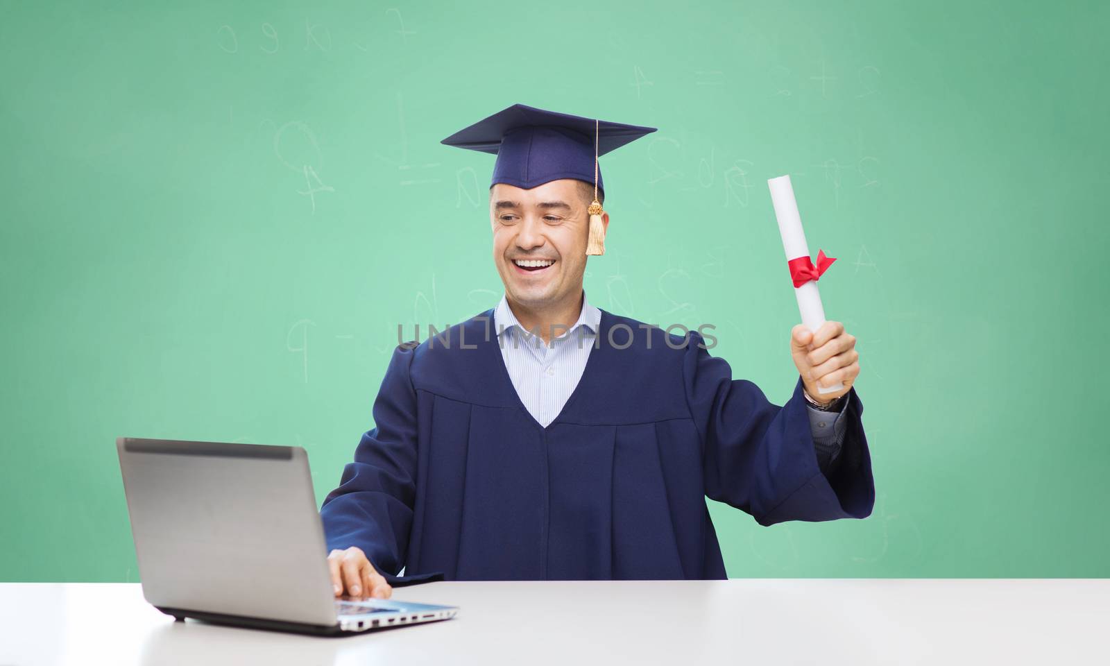 smiling adult student in mortarboard with diploma by dolgachov