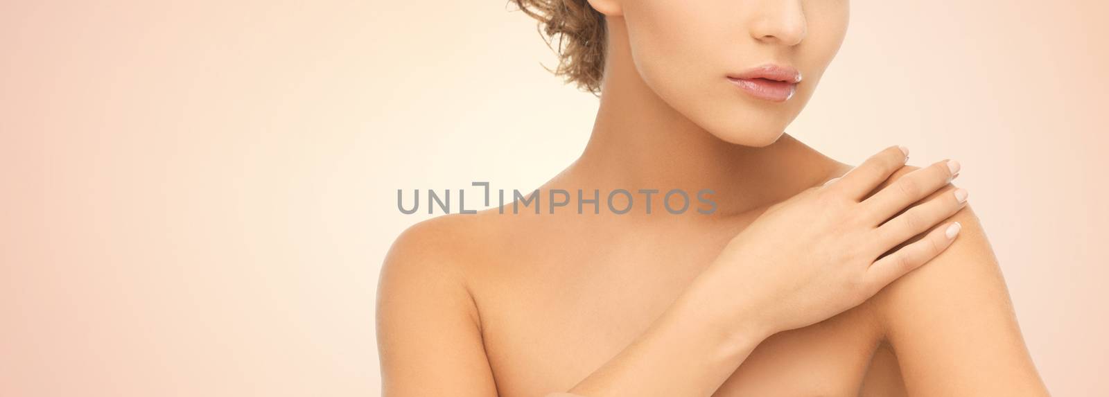 close up of young woman with bare shoulders by dolgachov