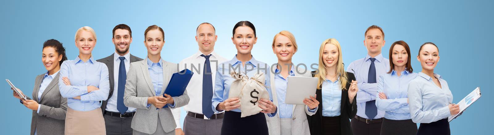 business, people, finances and banking concept - group of happy businesspeople with money bags over blue background