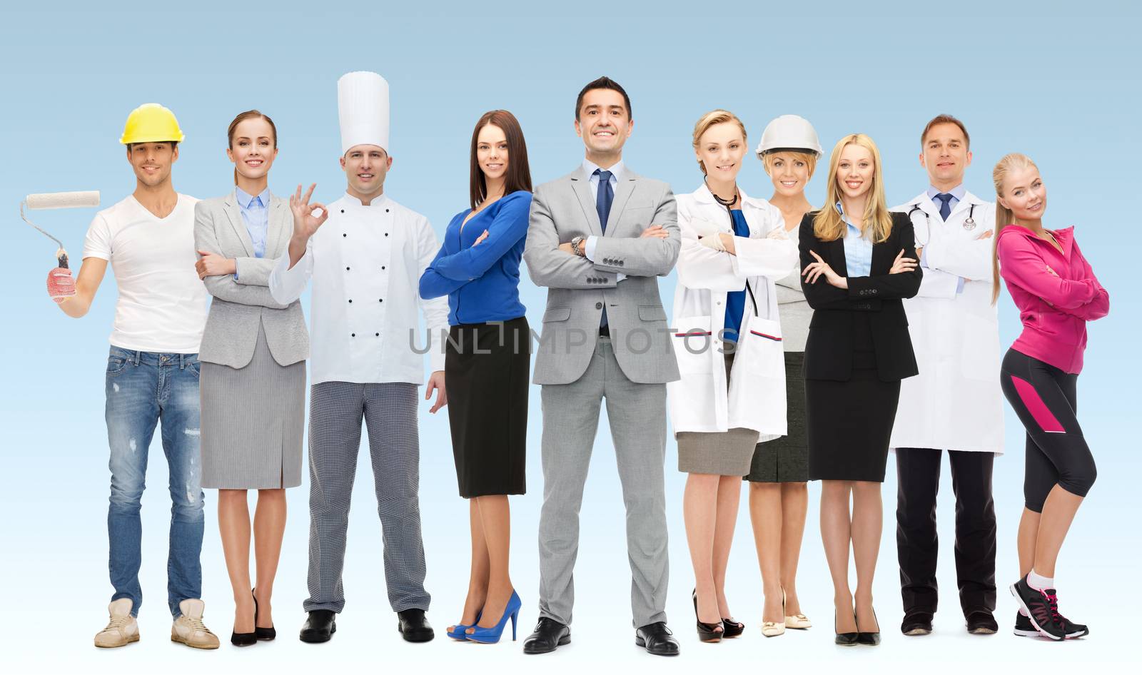 people, profession, qualification, employment and success concept - happy businessman with group of professional workers over blue background