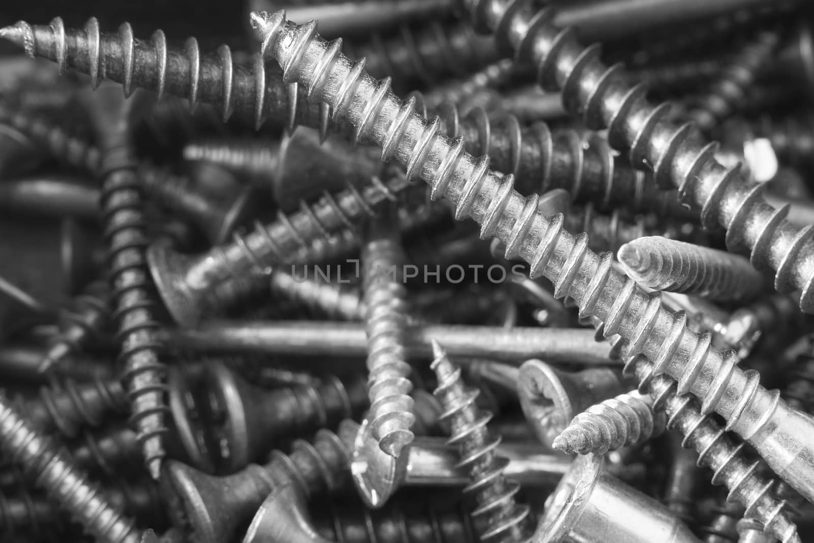 Screws as background, detail, many screws, silver