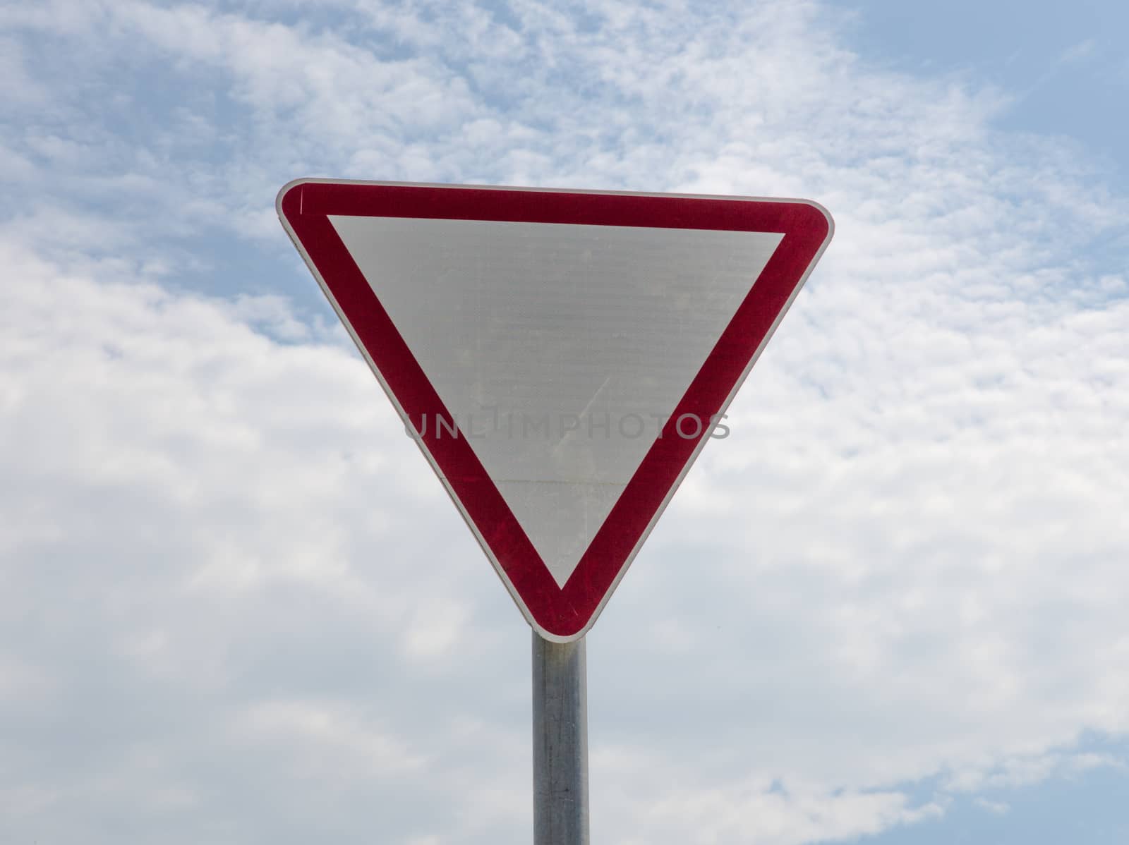 the give way sign on sky background