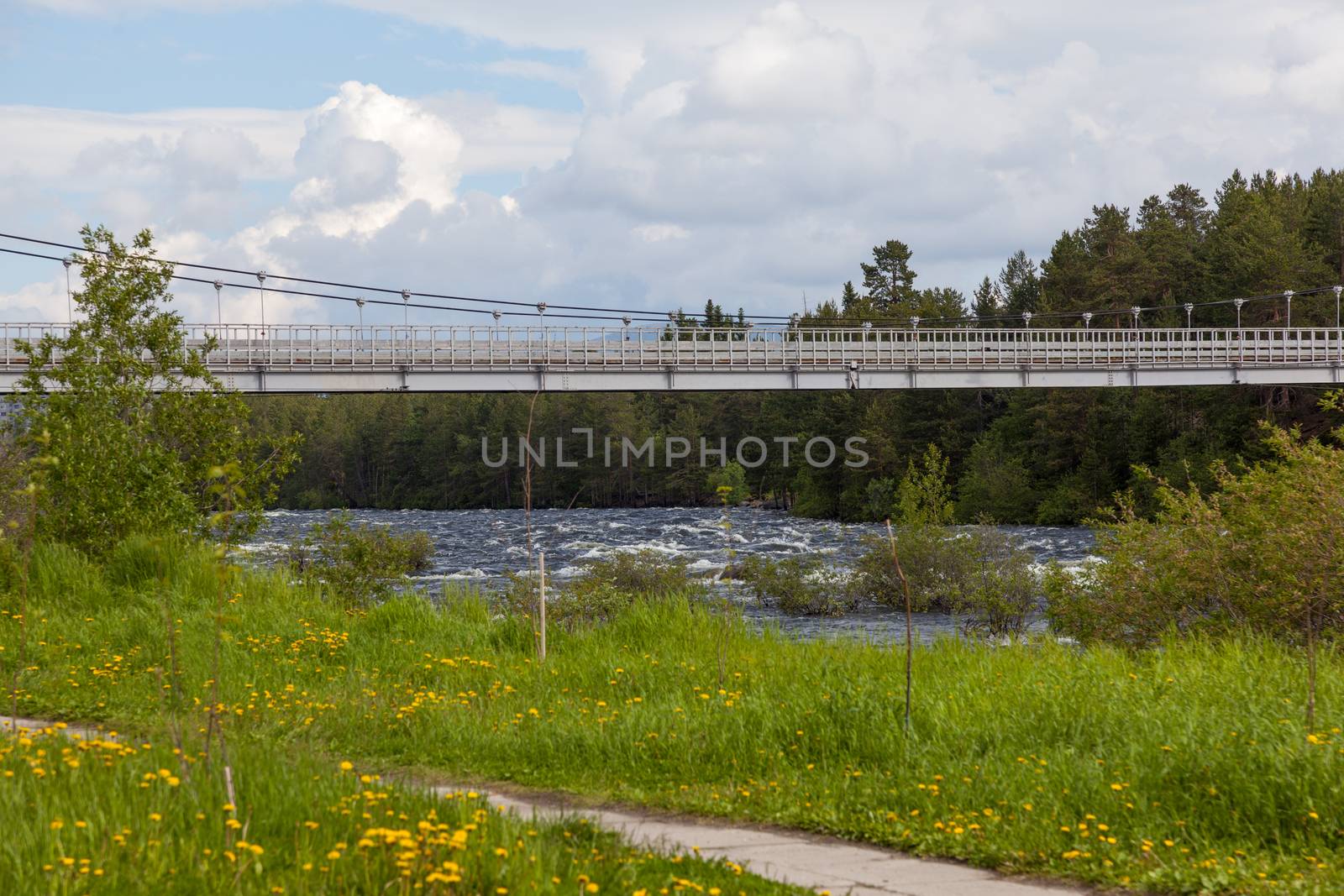 Suspension bridge over the River Niva Kandalaksha city. Russia