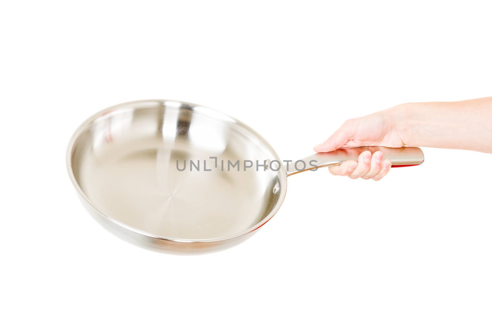 Steel frying pan hold by hand isolated on white background