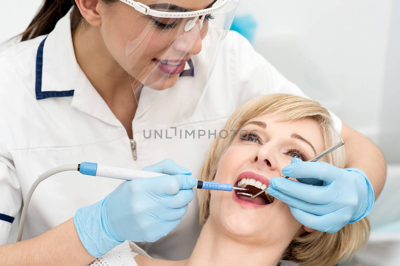 Woman under a dental treatment. by stockyimages