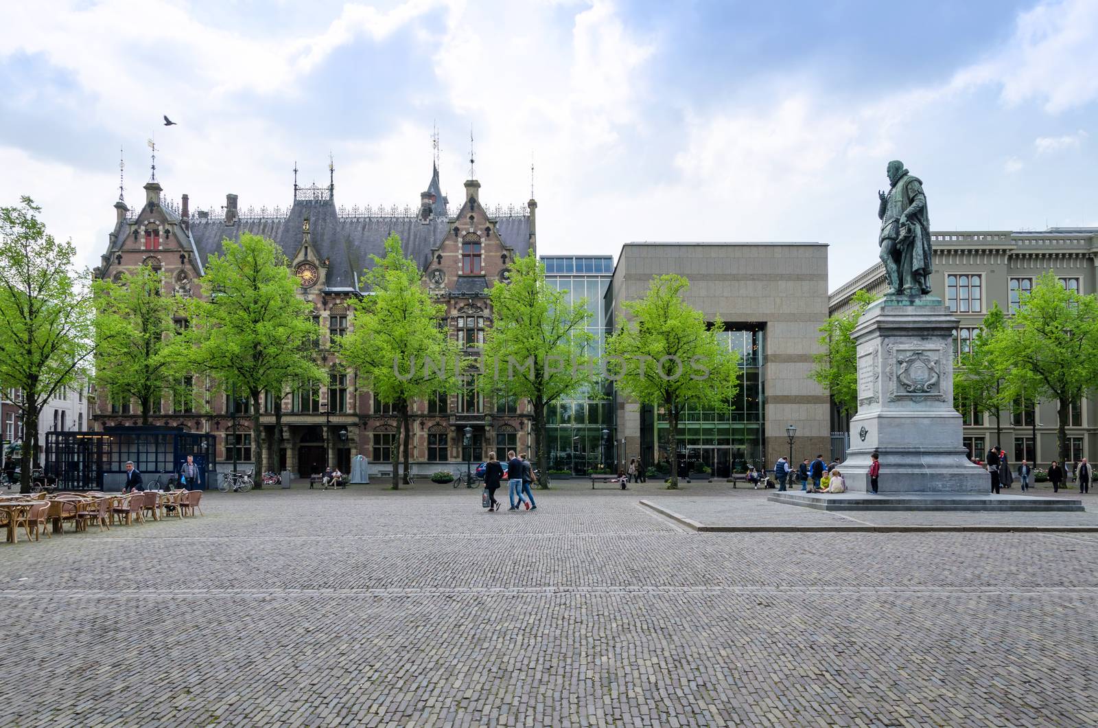 The Hague, Netherlands - May 8, 2015: People at Het Plein in The Hague's city centre, with the statue of William the Silent in the middle. on May 8, 2015.