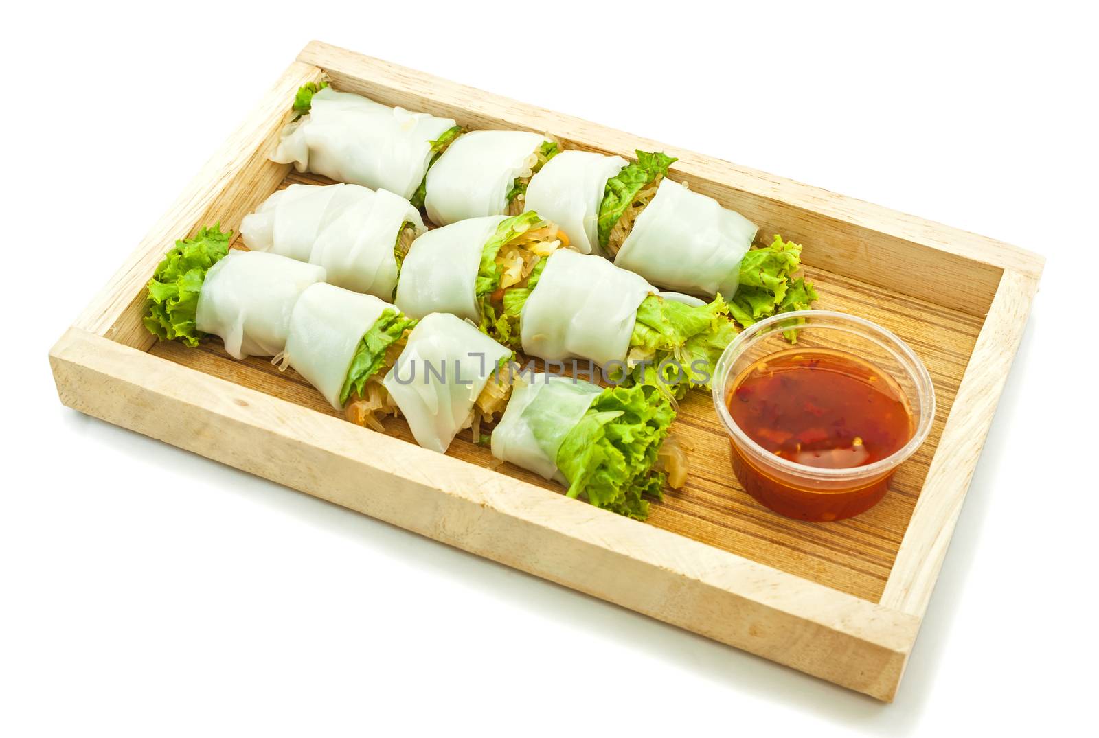 Rice paper wrapped vegetable with vermicelli noodles and a thai peanut sauce