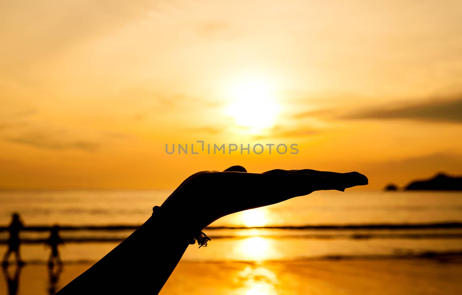 Hand with sunset by jimbophoto