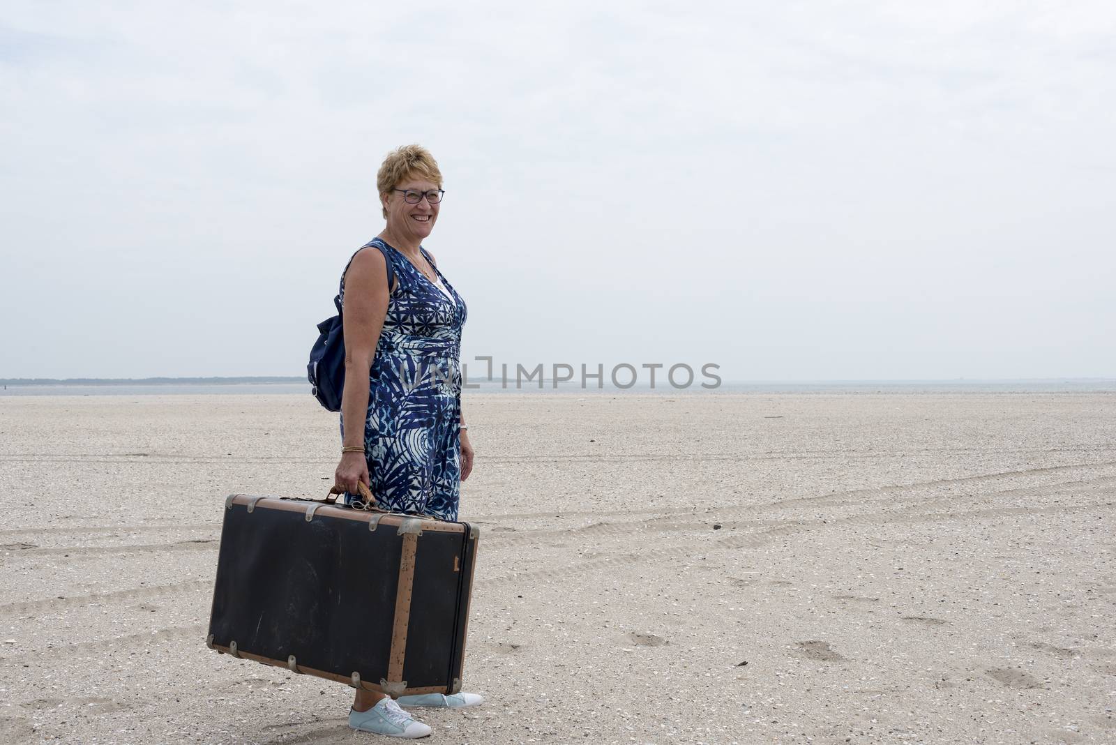 woman with old suitcase   by compuinfoto