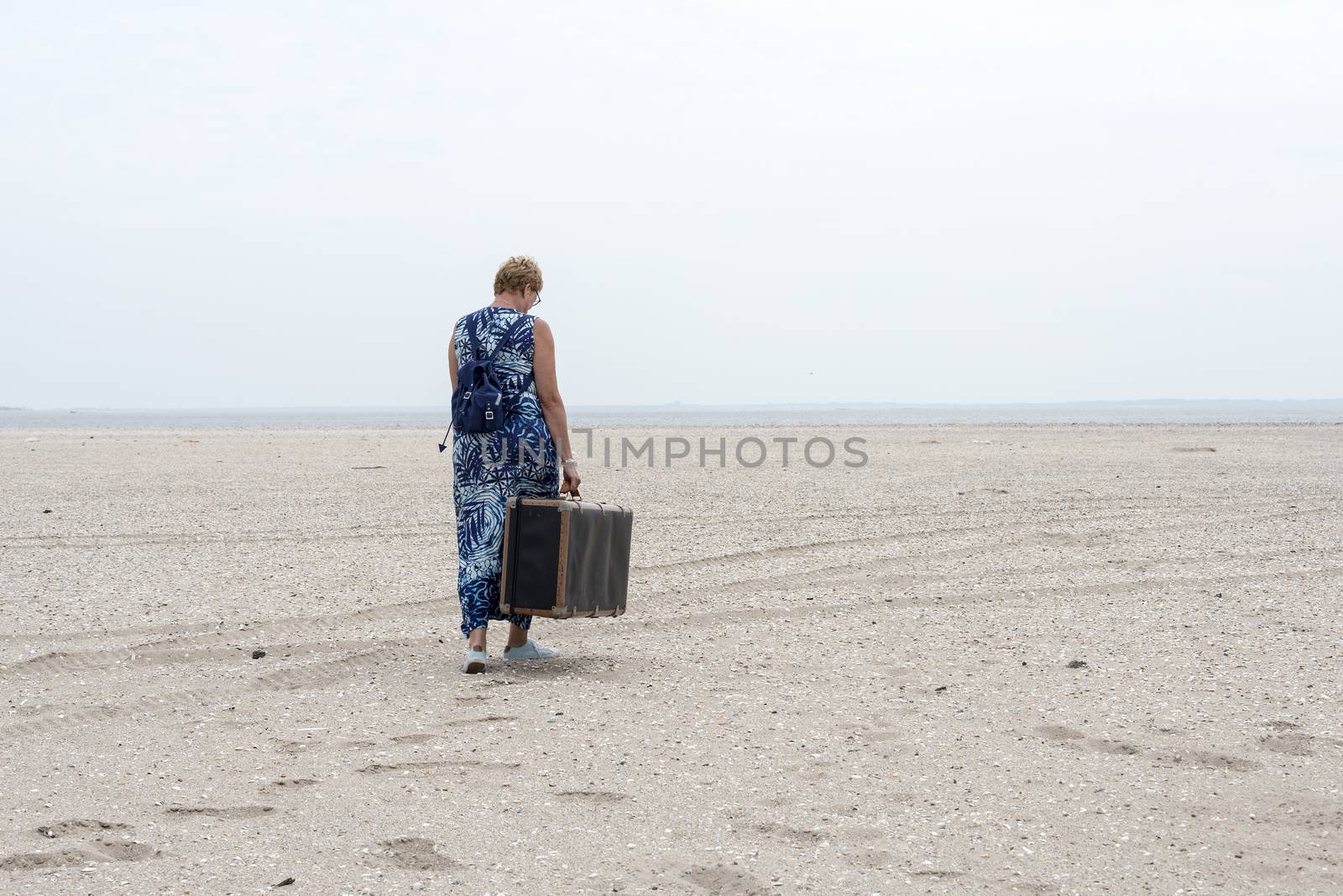 woman with old suitcase   by compuinfoto