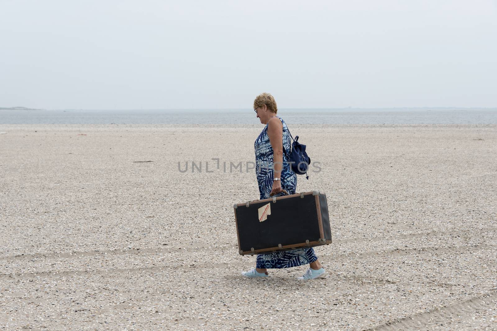 woman with old suitcase   by compuinfoto