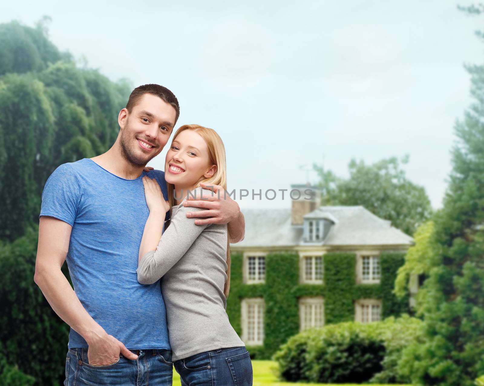 love and family concept - smiling couple hugging