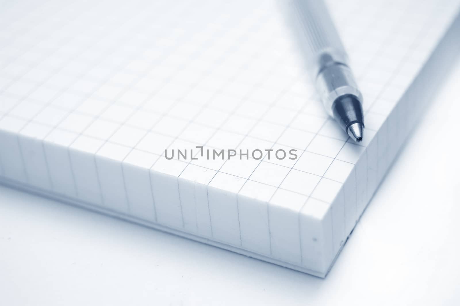 Education conceptual image. Close up of a notebook and pen.