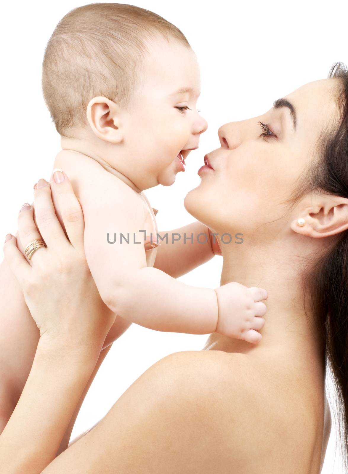 happy mother kissing baby by dolgachov