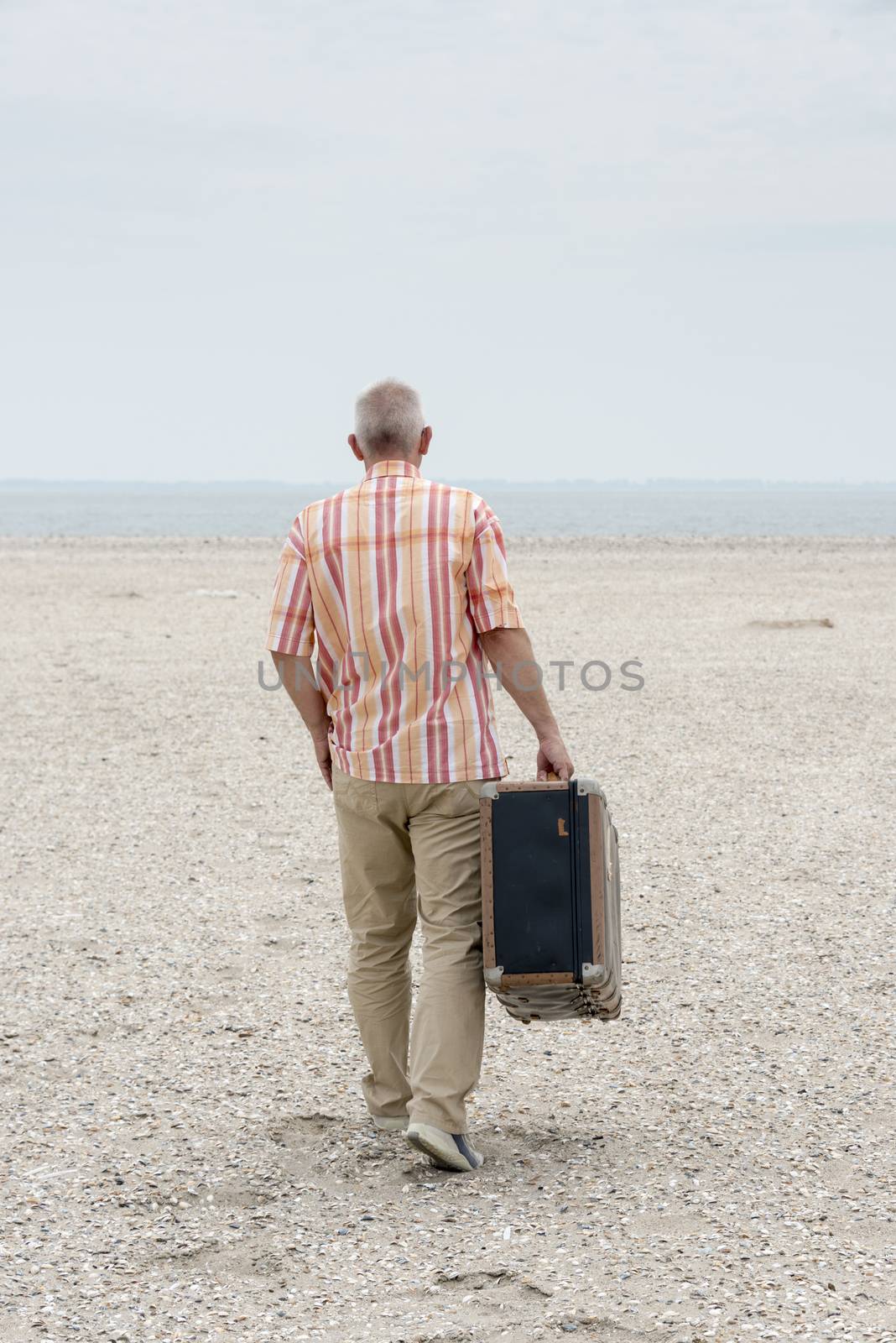  man with old suitcase   by compuinfoto